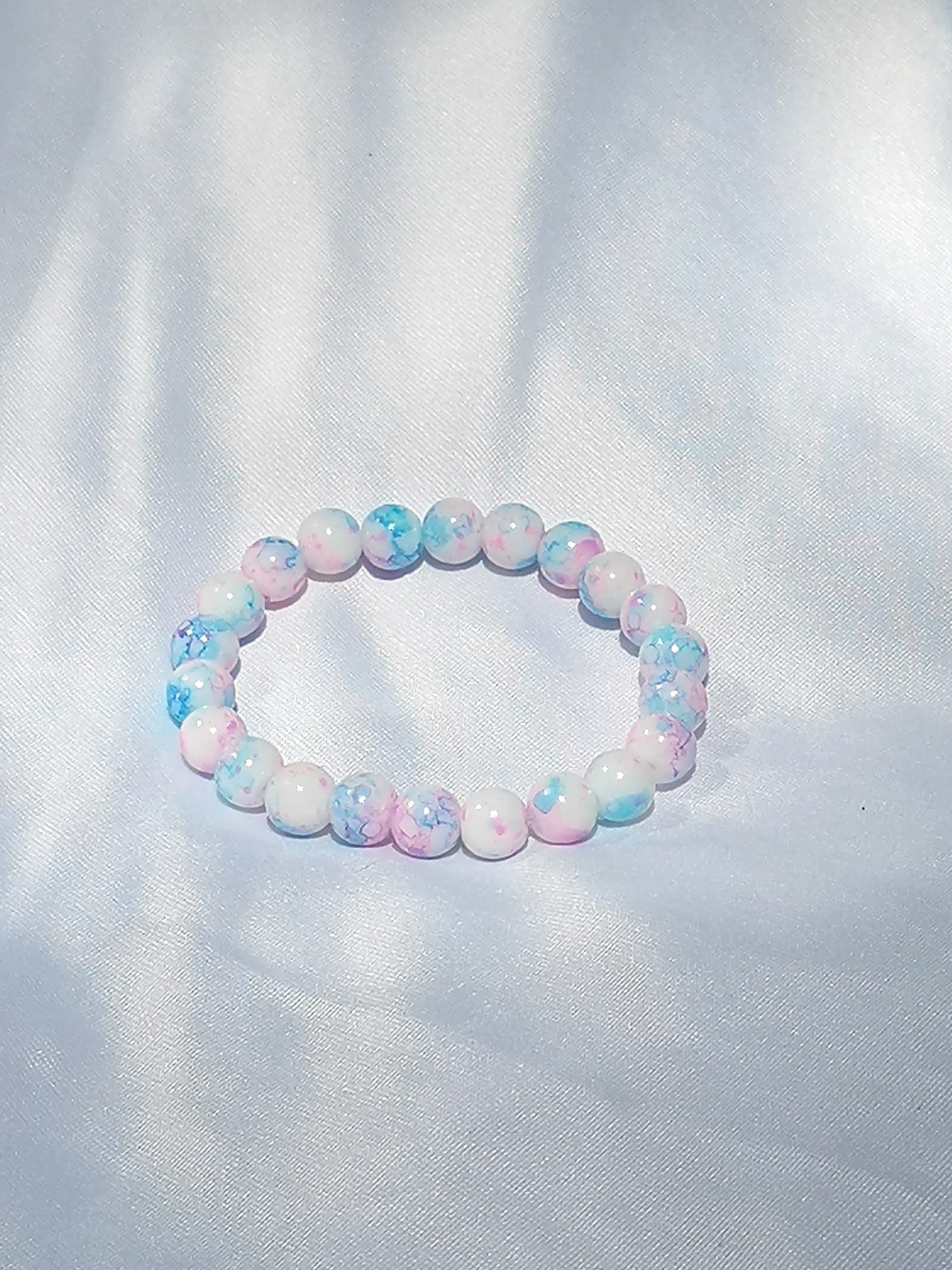 Pink, blue and white elasticated bracelet