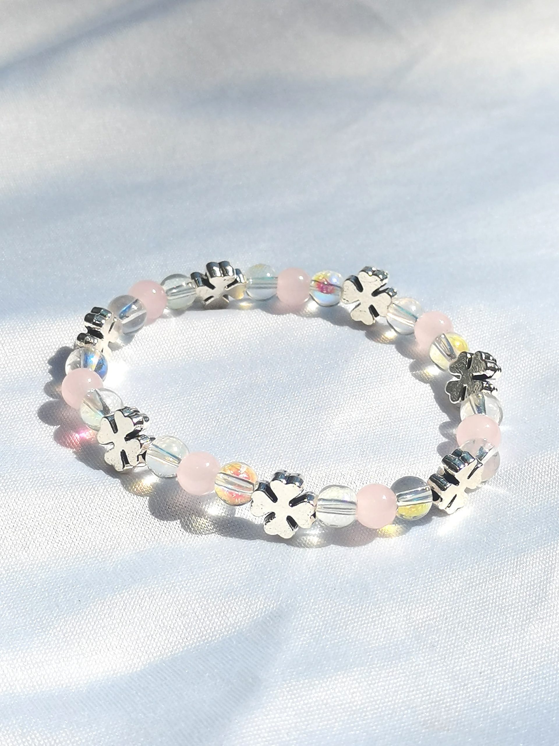 Pink, clear two tone and clover spacer elasticated bracelet