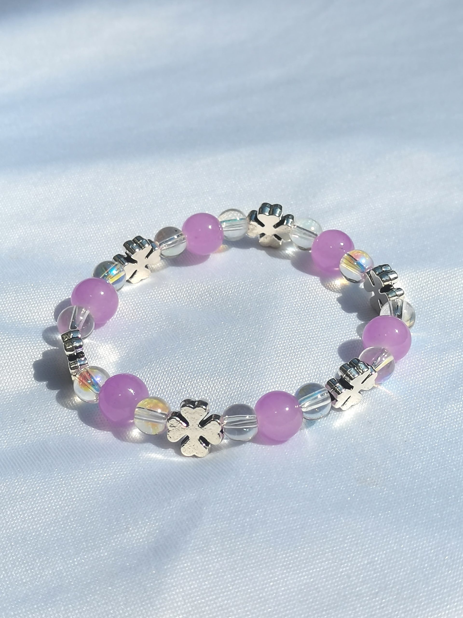 Purple, clear two tone and clover spacer elasticated bracelet