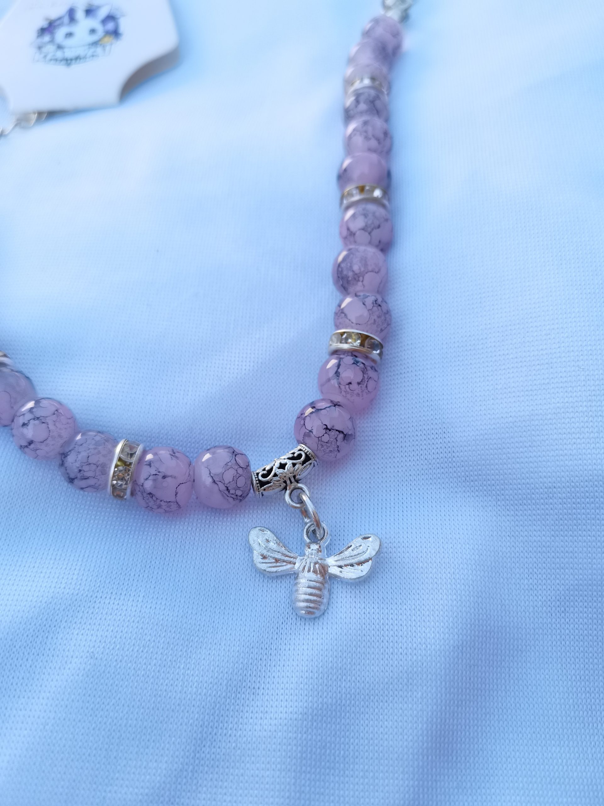 Purple and black adjustable bracelet with silver bee charm