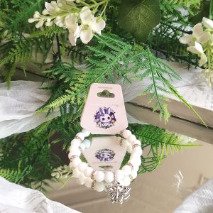 Solid white bead with vintage butterfly