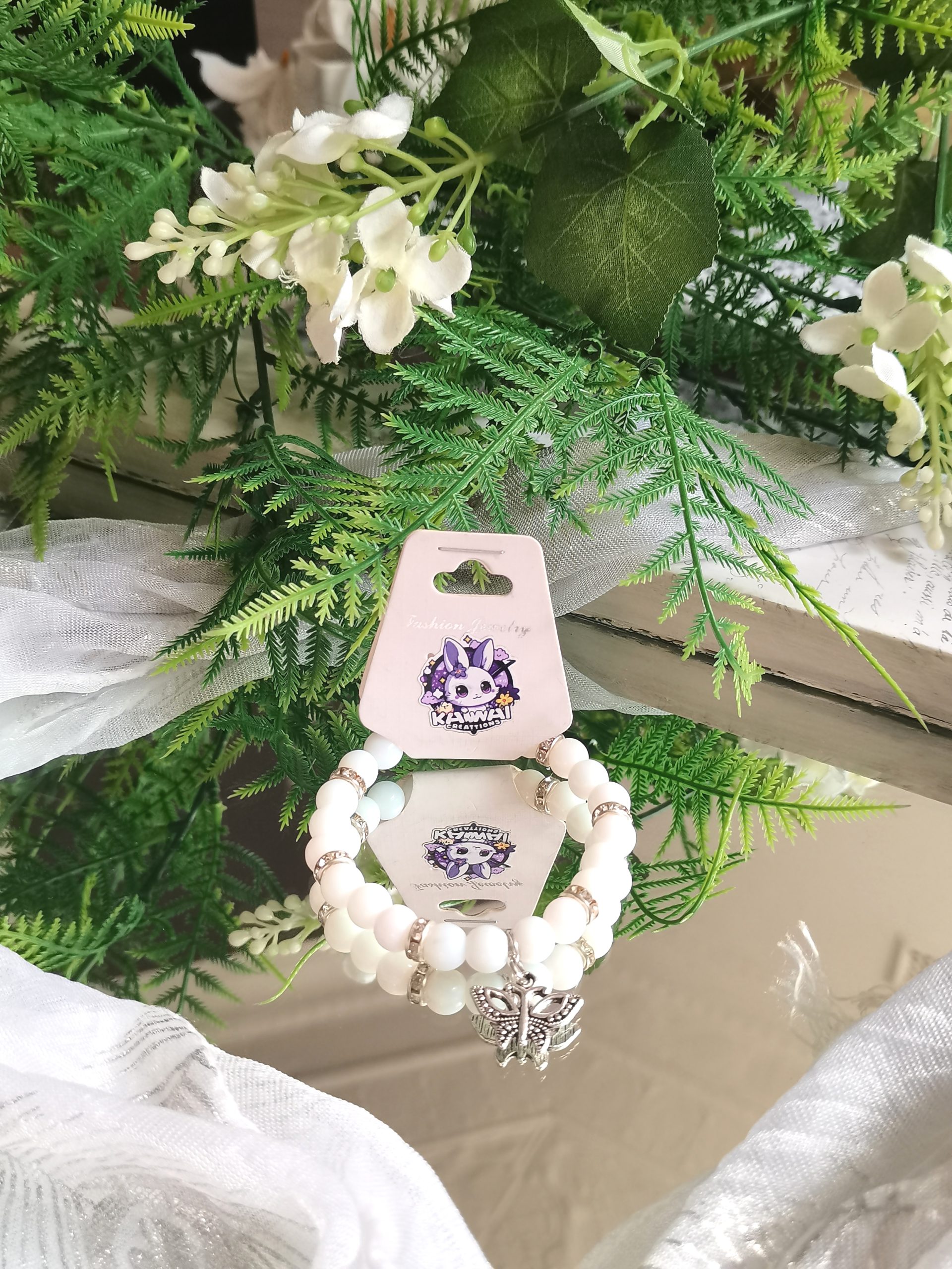 Solid white bead with vintage butterfly