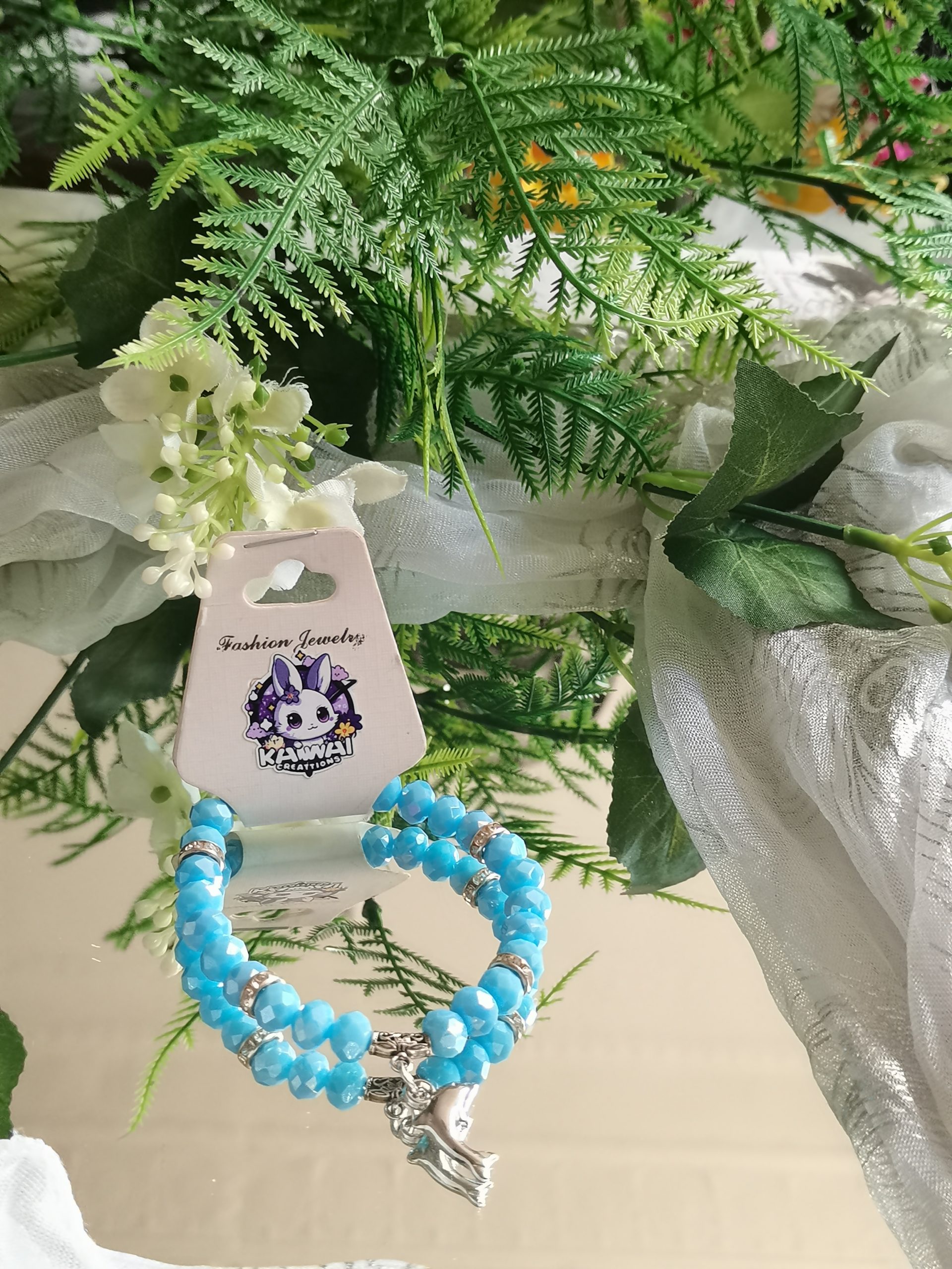 Powder blue crystal bracelet with Dolphine & silver spacers