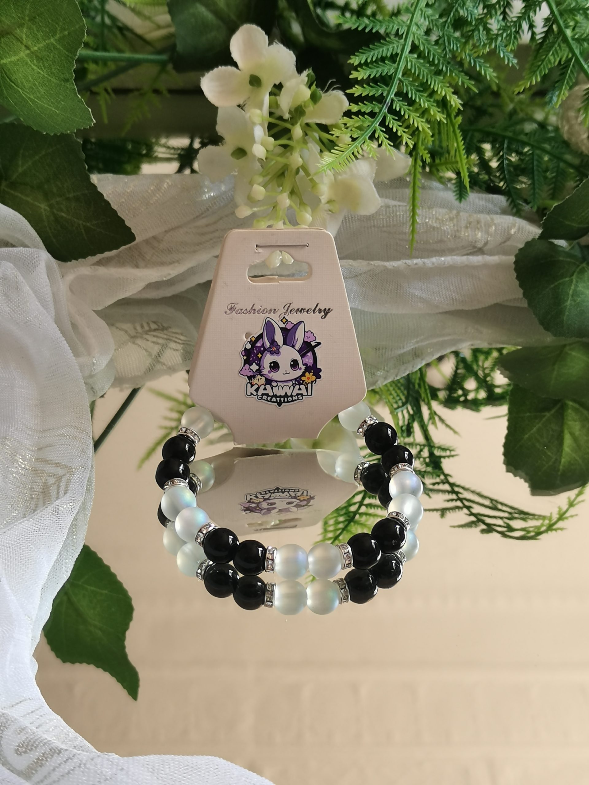 Solid black and frosted bead with silver spacers