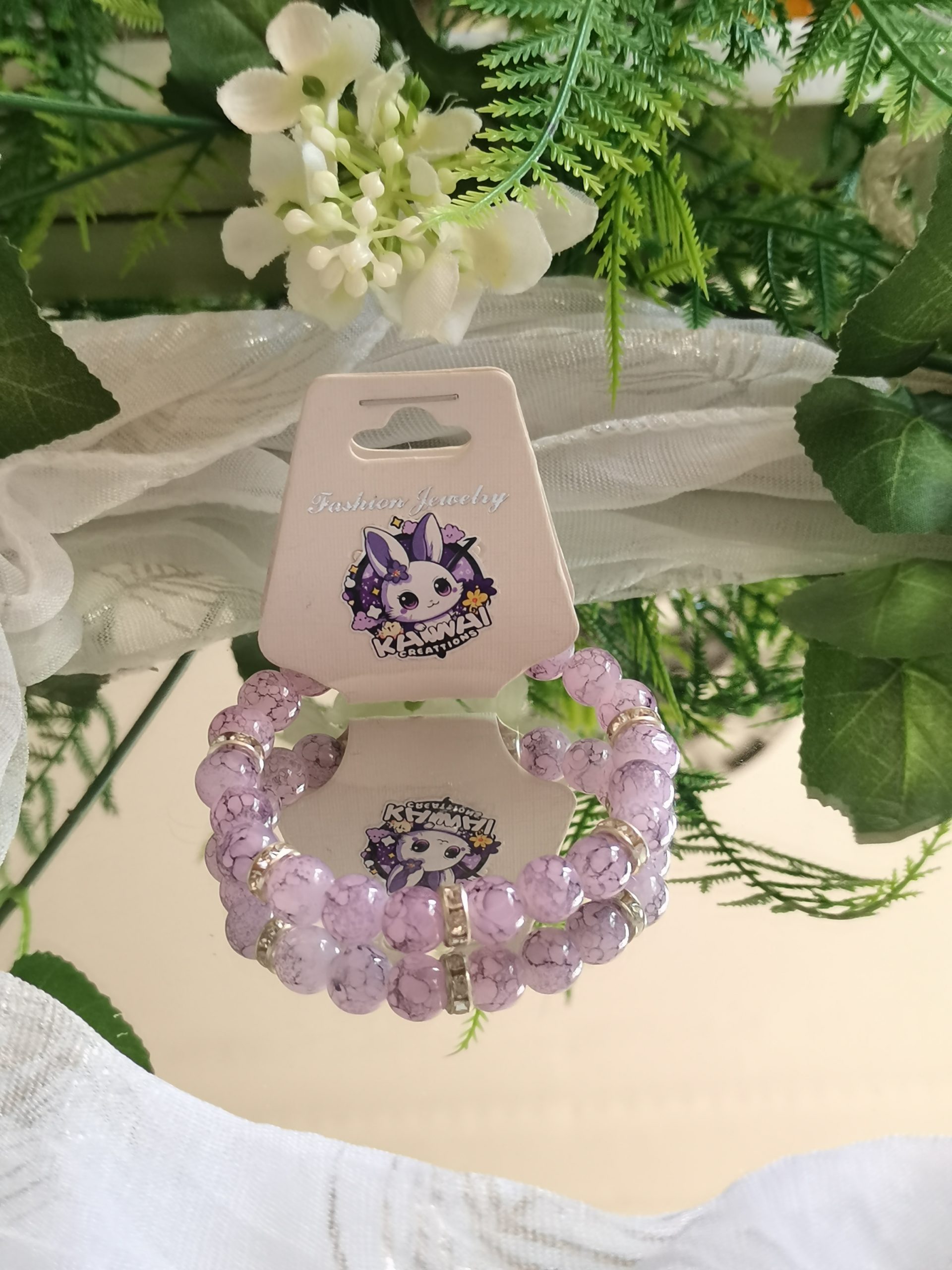 Purple and black elasticated bracelet with silver spacers