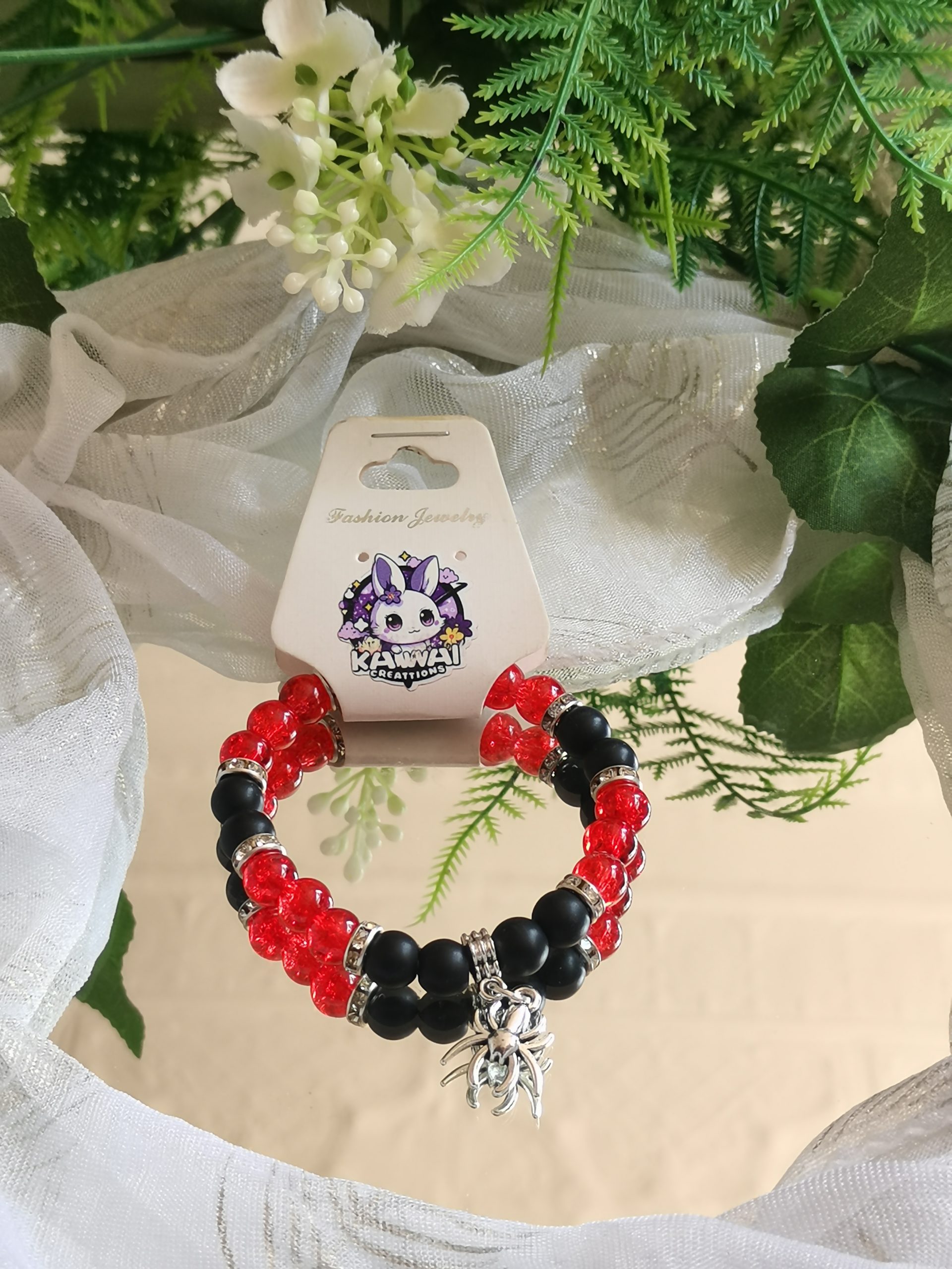 Black lava & red glass spider charm elasticated bracelet
